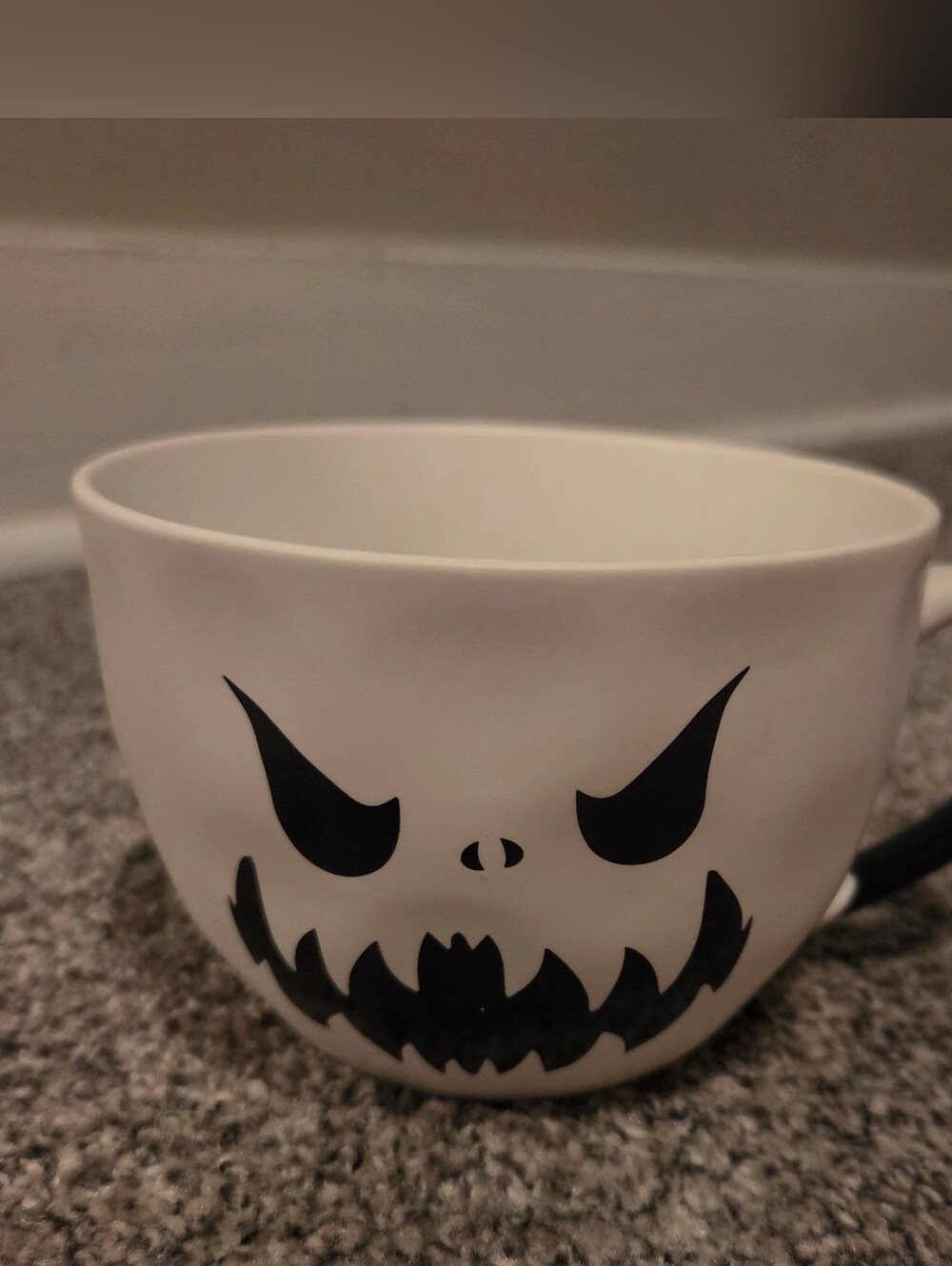 White Ceramic Halloween Mug with Black Scary Face